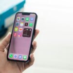 a person holding an iphone in their hand